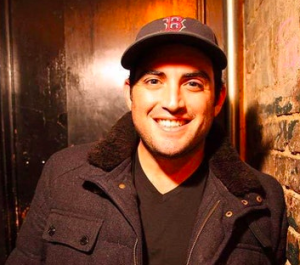 Jared Freid performing at Live at the Barbershop