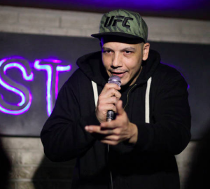 Luis J. Gomez performing at Live at the Barbershop